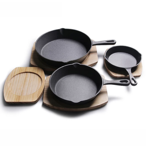 CAST IRON PAN WITH WOODEN PAD